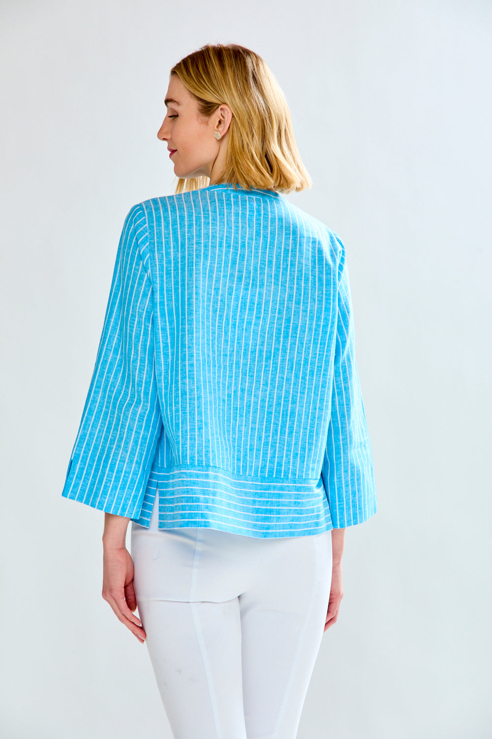 Woman in blue striped tunic