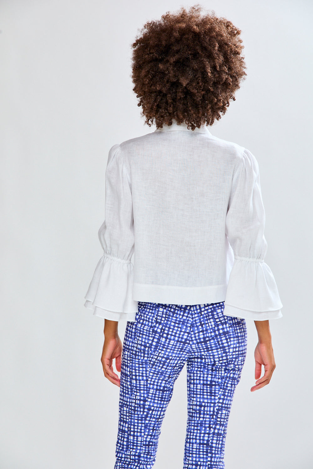 Woman in white linen top