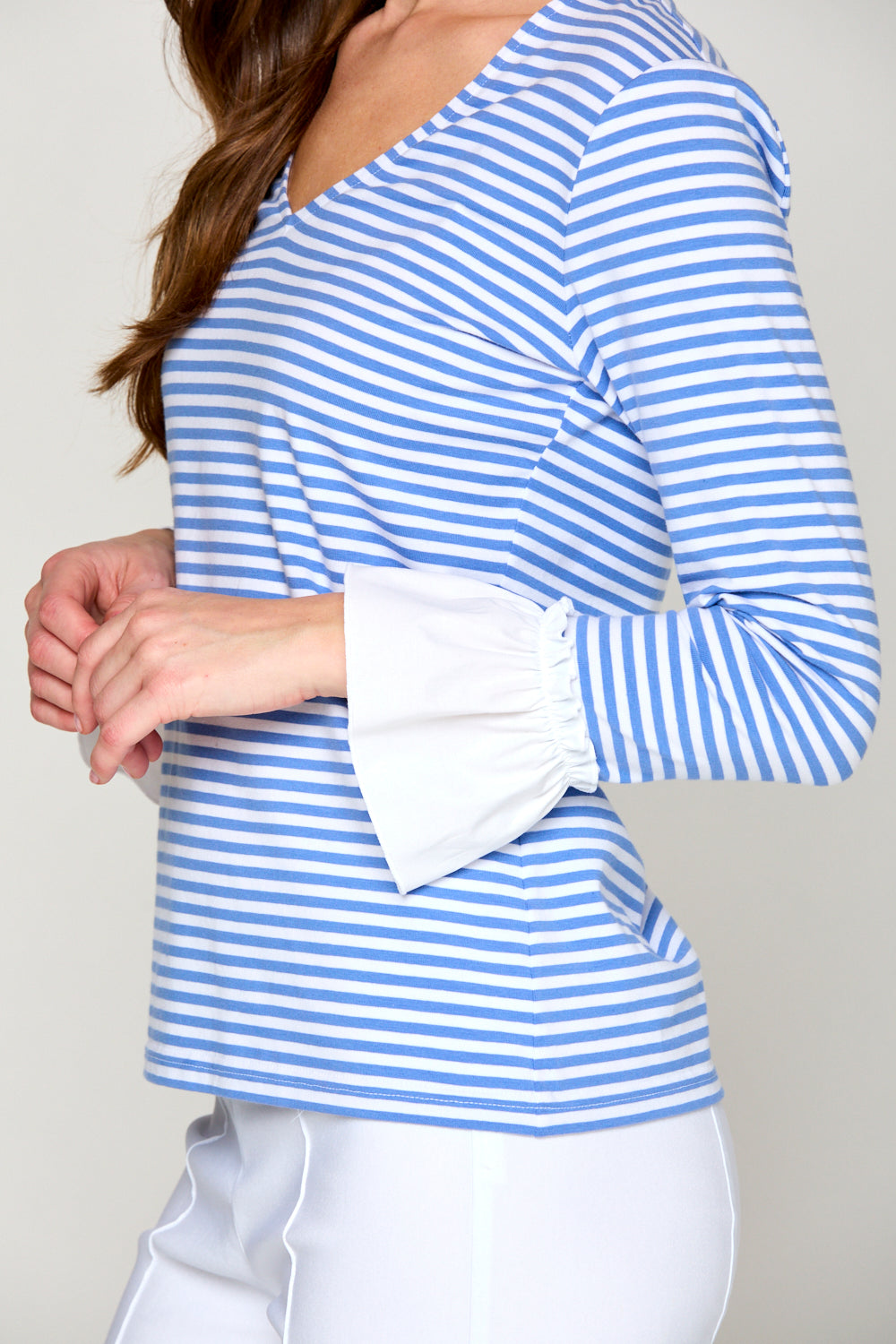 Woman in blue and white stripe top