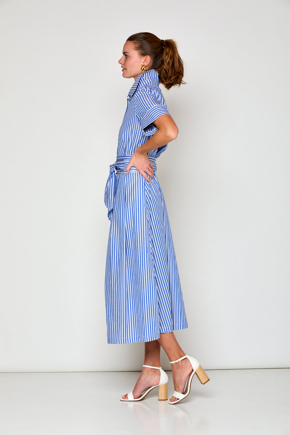 Woman in stripe maxi dress