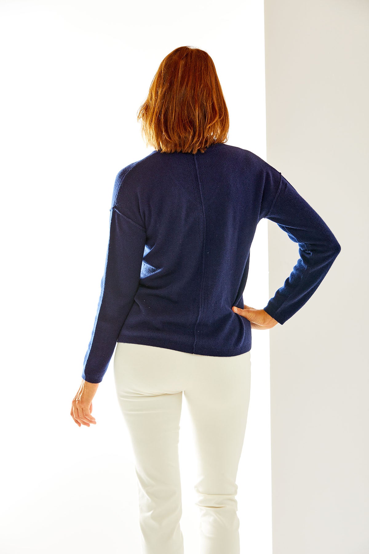 Woman in navy cashmere sweater