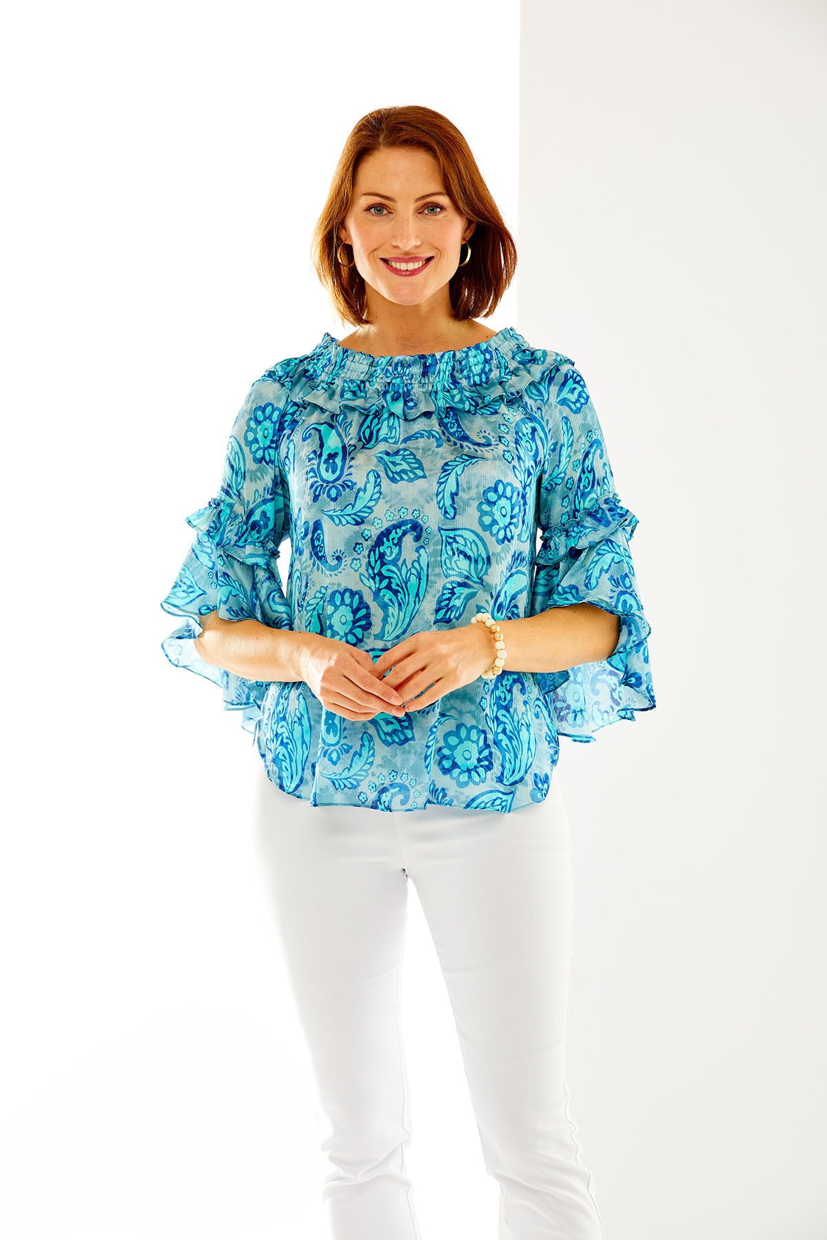 Woman in blue paisley blouse