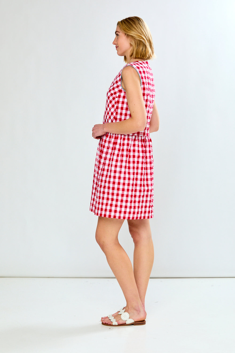 woman in red check dress