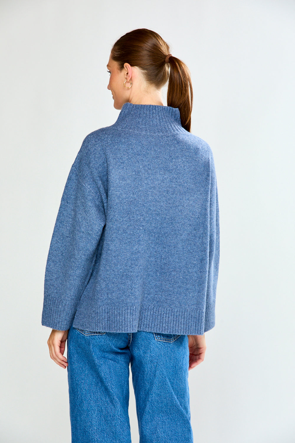 Woman in denim sweater with jeans