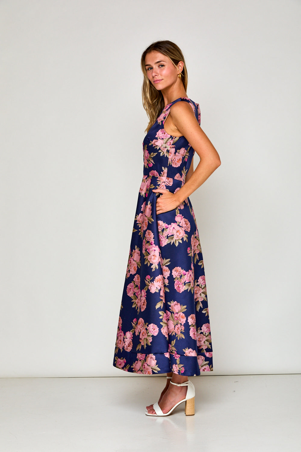 Woman in navy floral dress