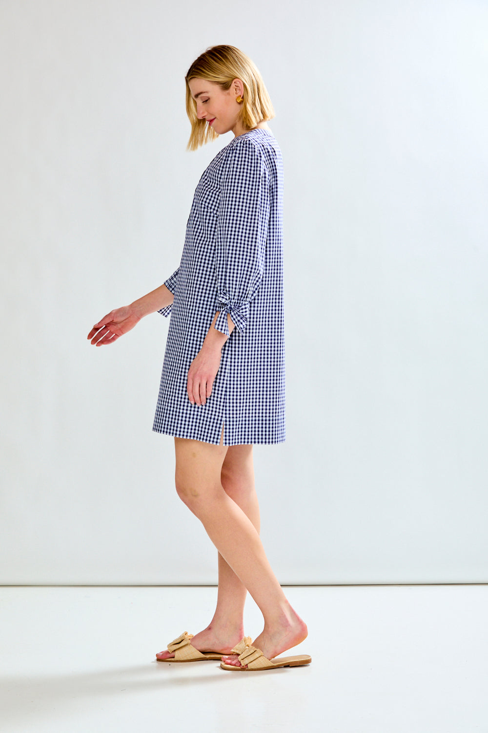 woman in plad dress with sleeves