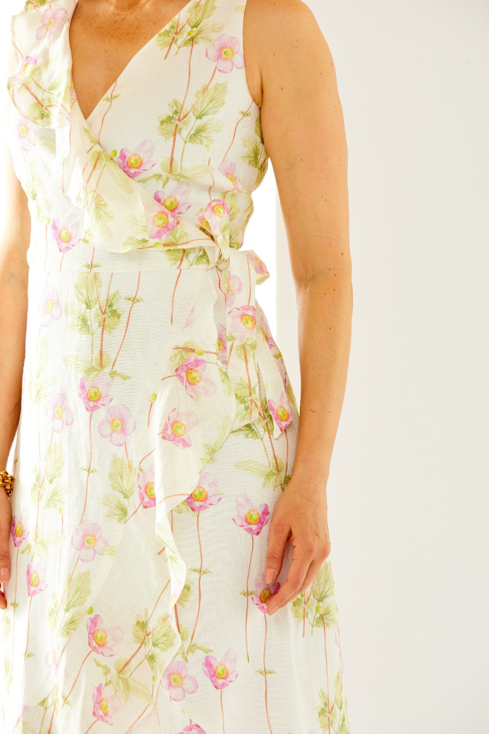 Woman in floral wrap dress