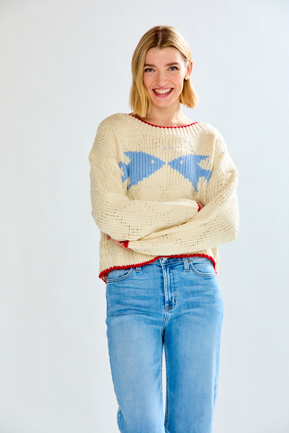 Woman with cream fish sweater on