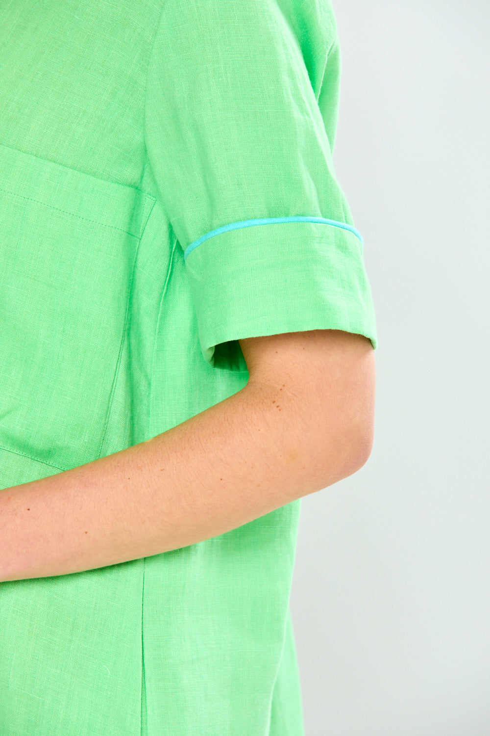 Woman in green linen dress