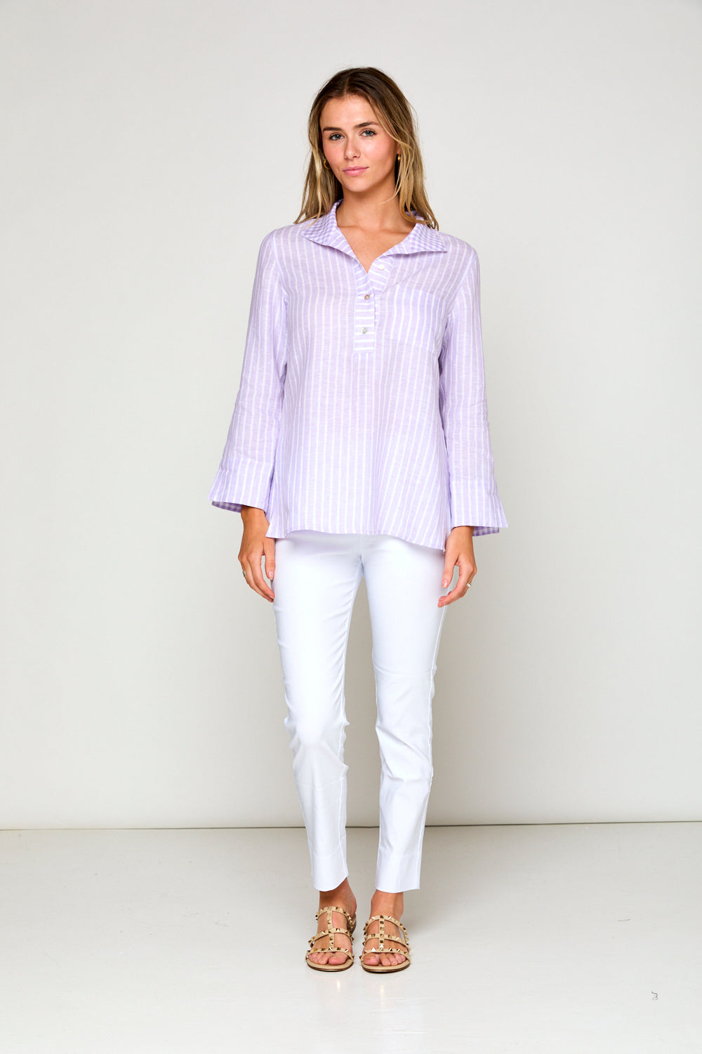 Woman in purple and white striped blouse