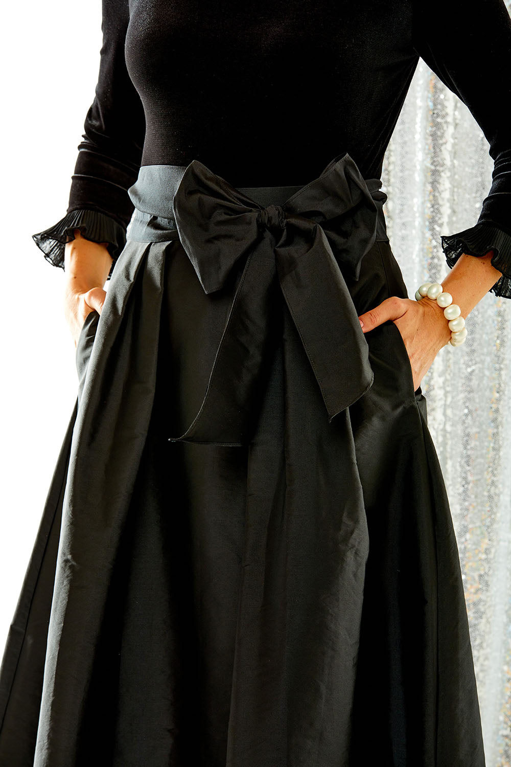 Woman wearing black taffeta skirt