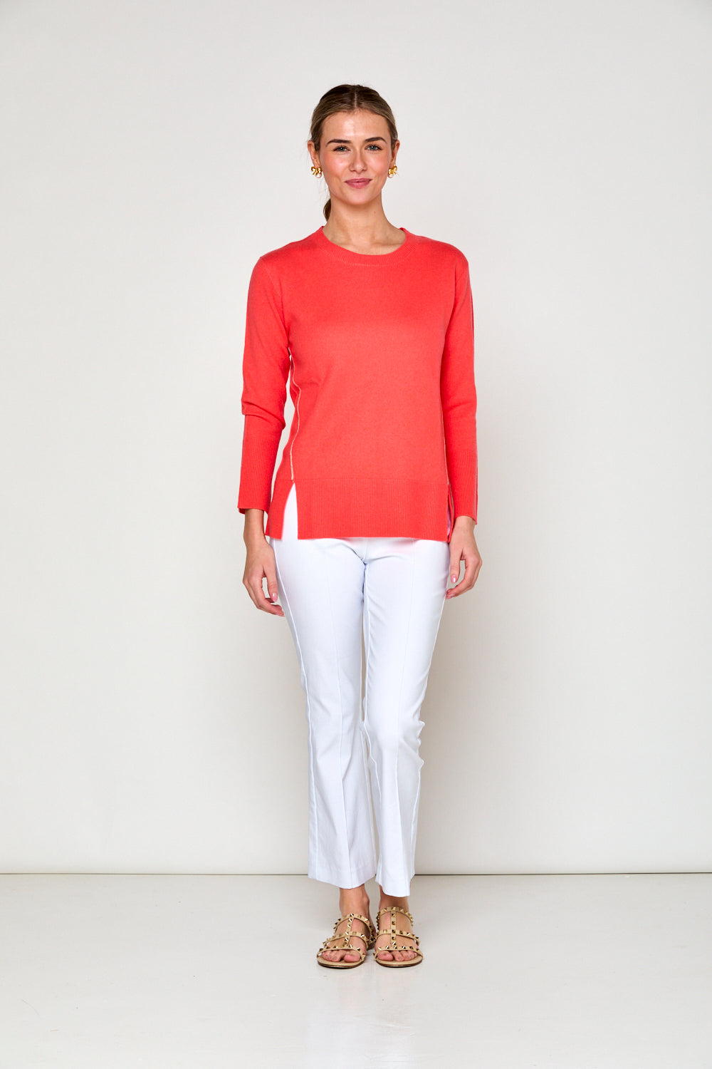 Woman in coral sweater