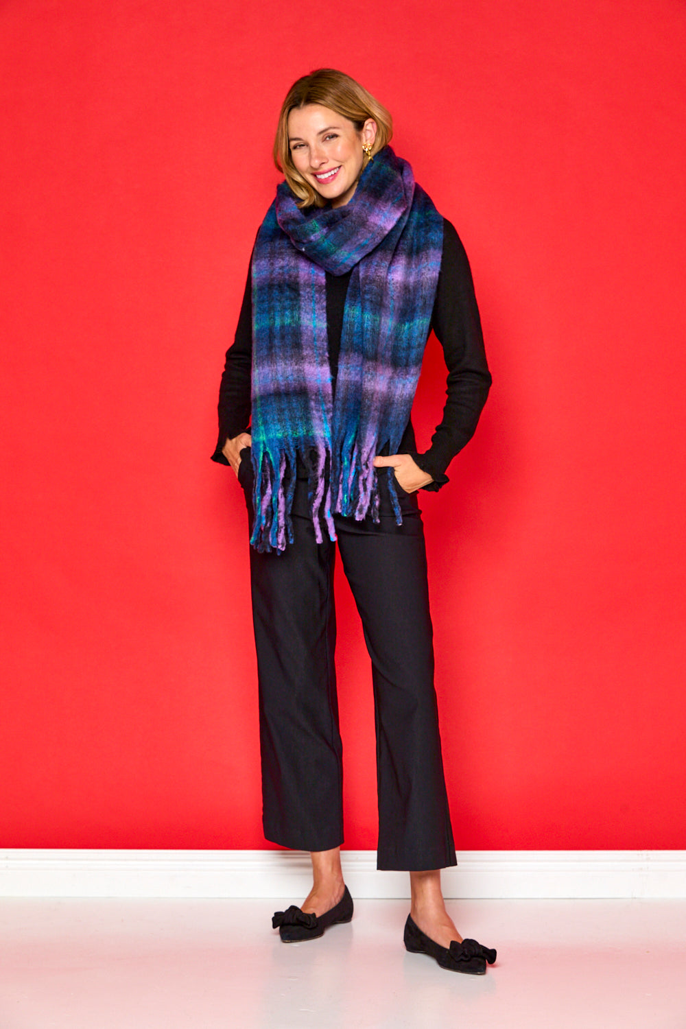 Woman in navy blanket scarf