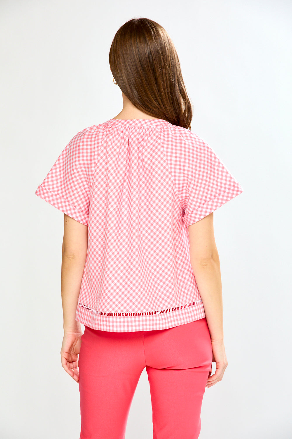 woman in pink gingham top