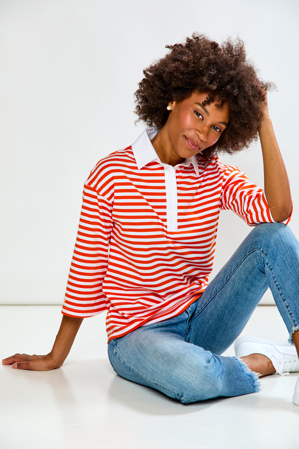 Woman in Orange & White Stripe top