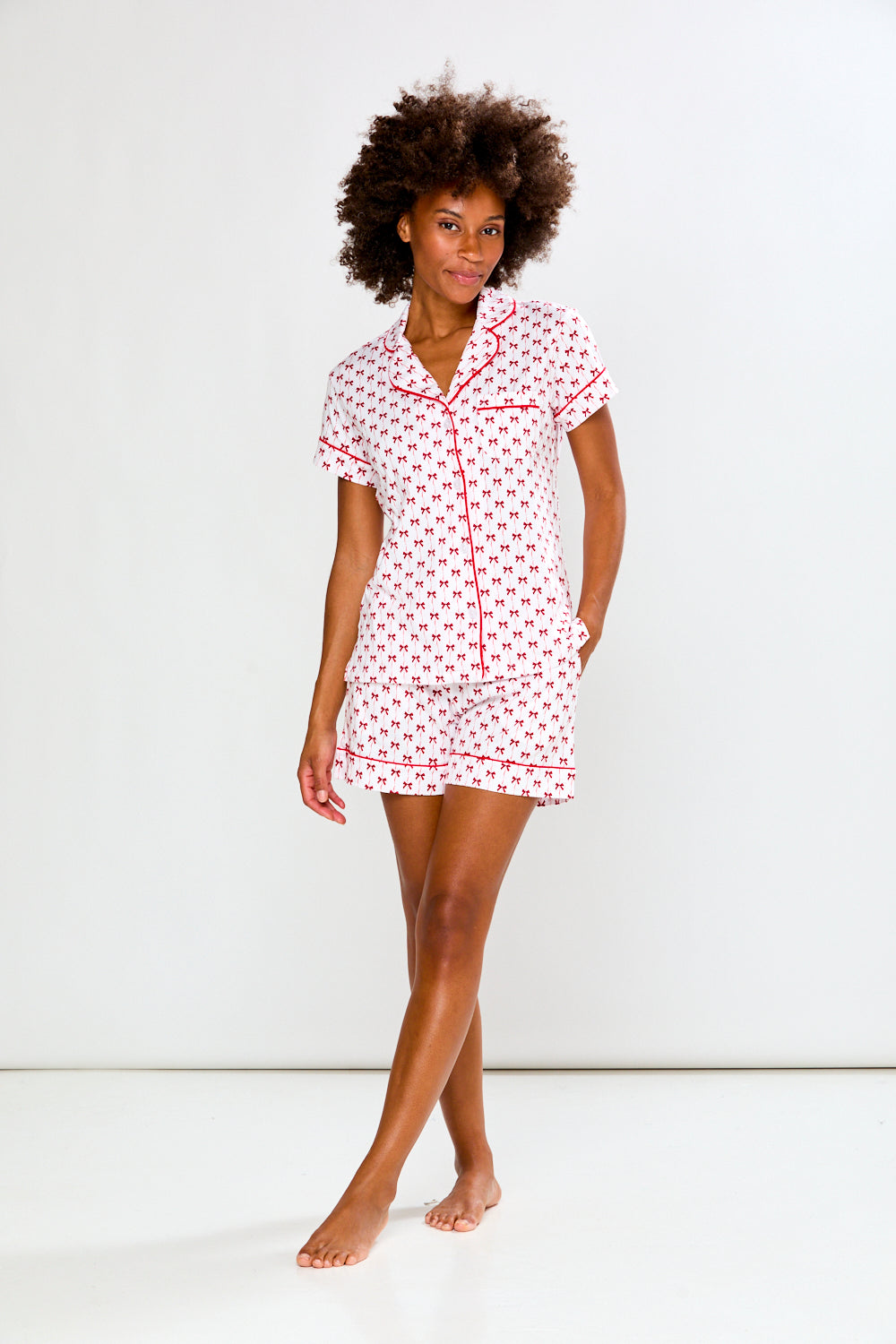 Woman in bow printed pajamas