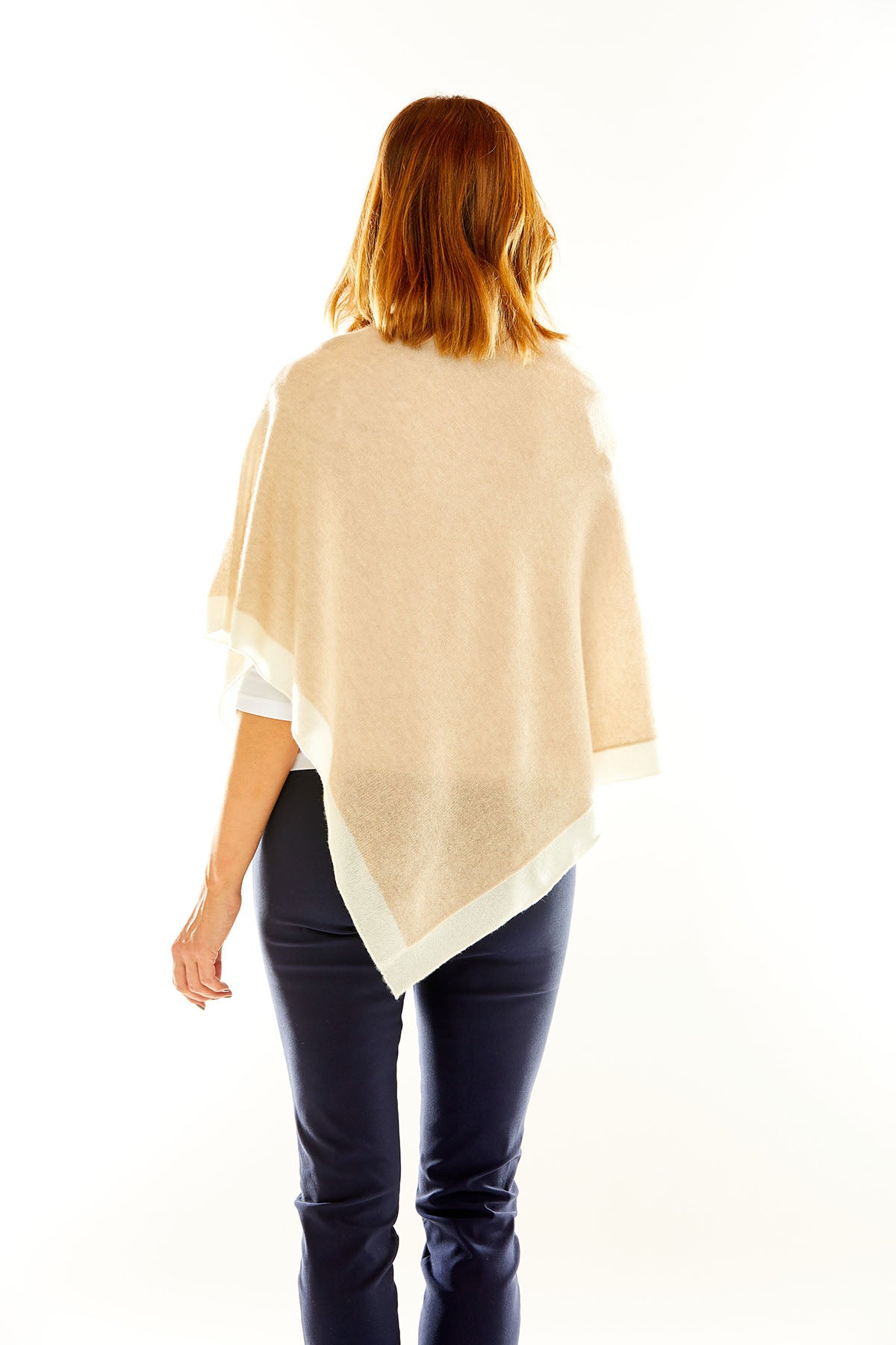 Woman in sand poncho