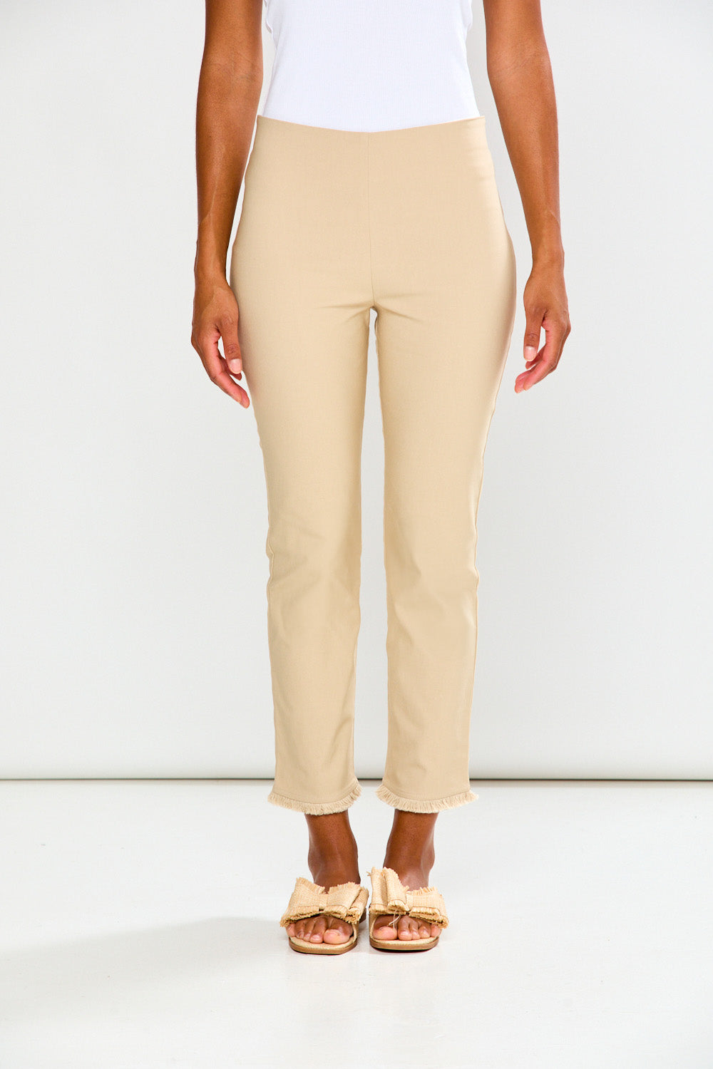 Woman wearing sand pants on a white background