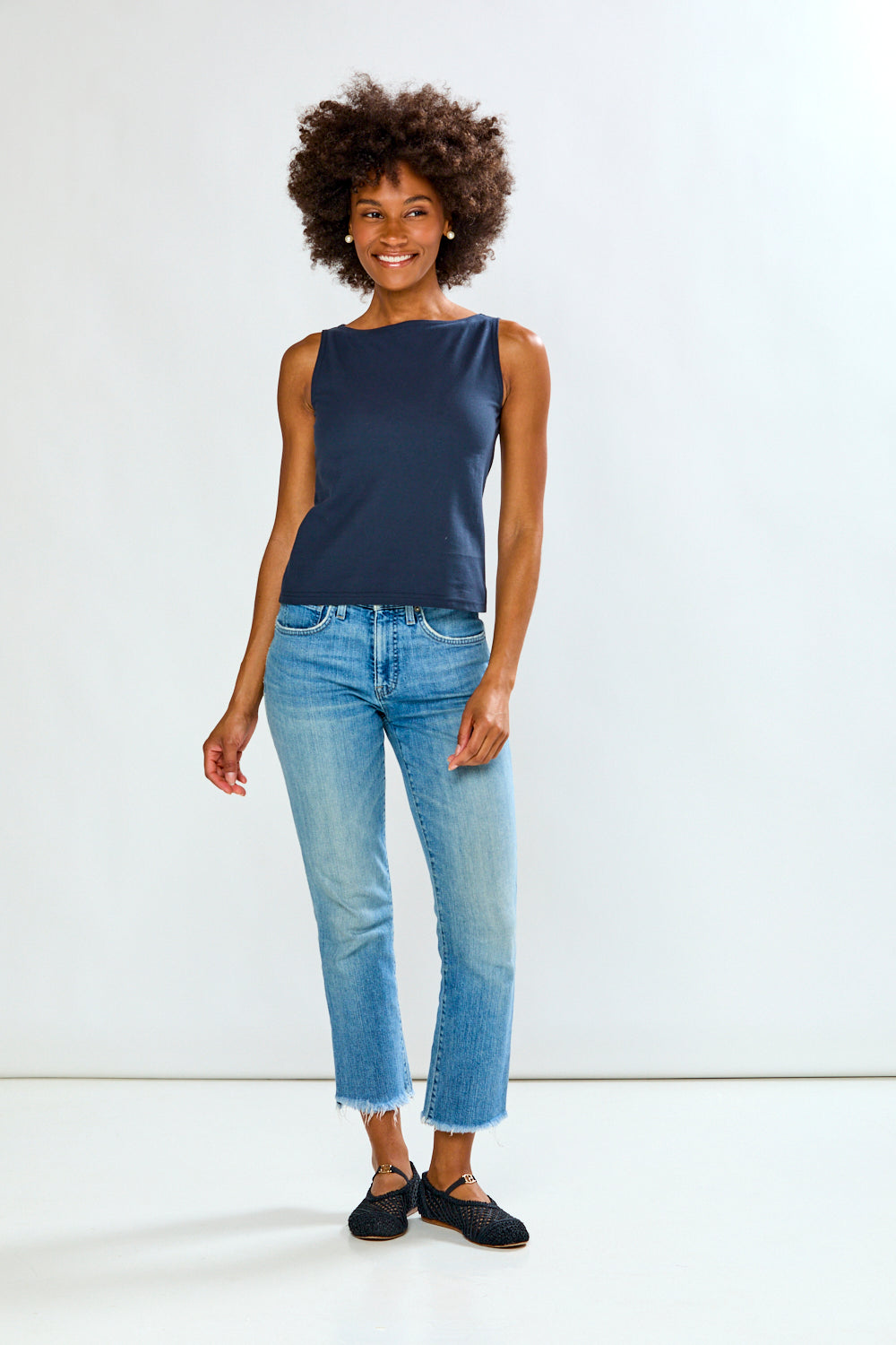 Woman in solid top and jeans