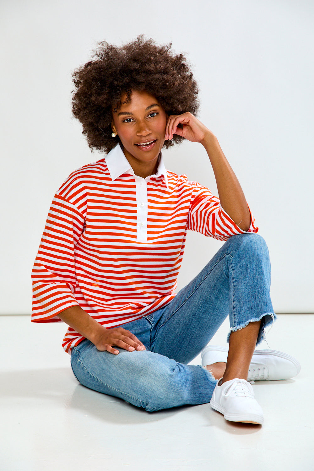 Woman in Orange & White Stripe top