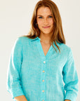 Woman in aqua linen shirtdress