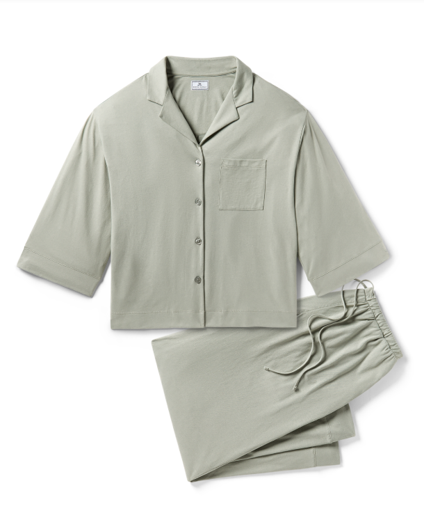 Woman in sage green pajamas