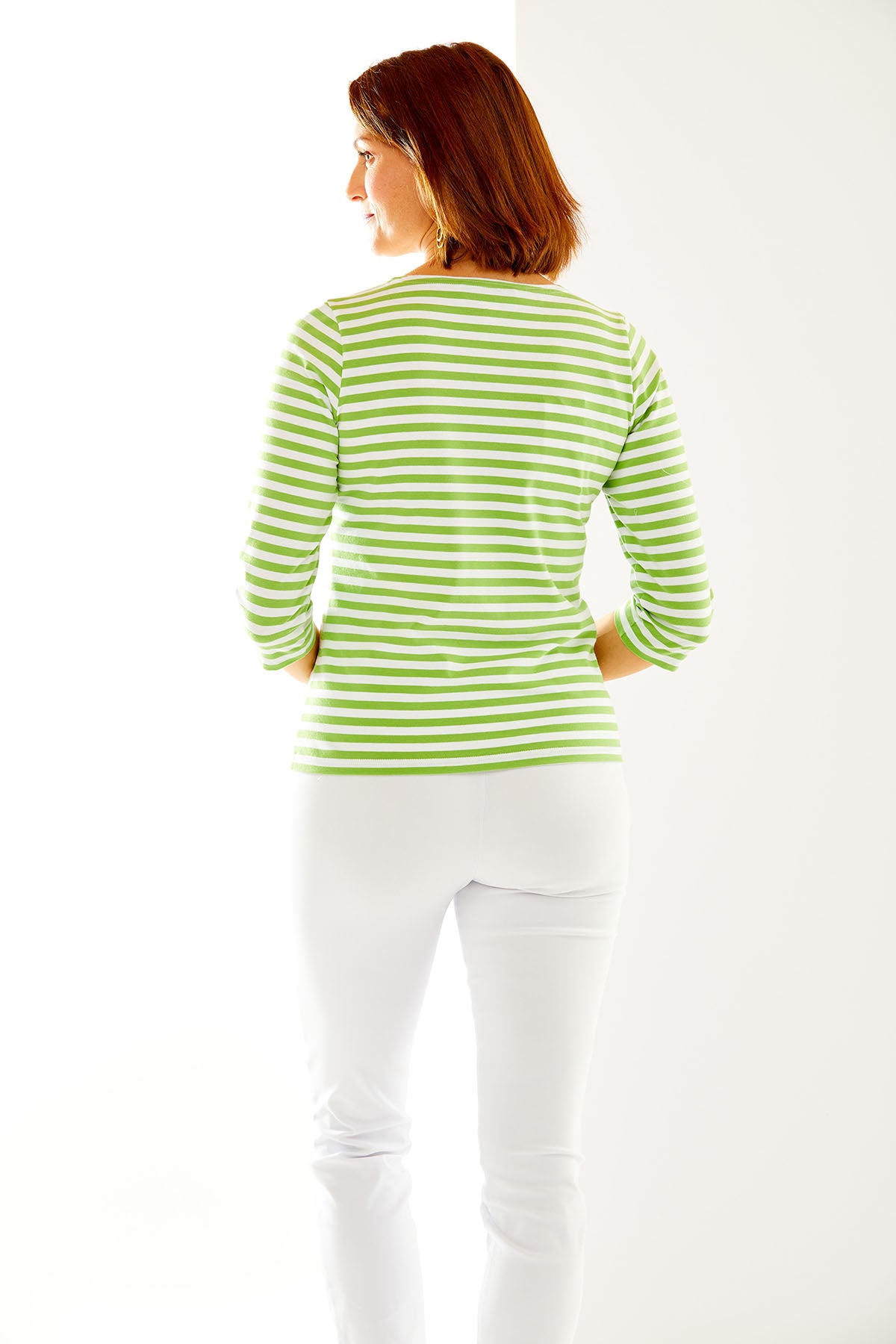 Woman in avocado/white stripe top