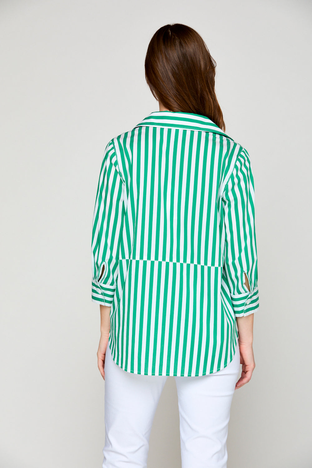 Woman in green and white stripe blouse