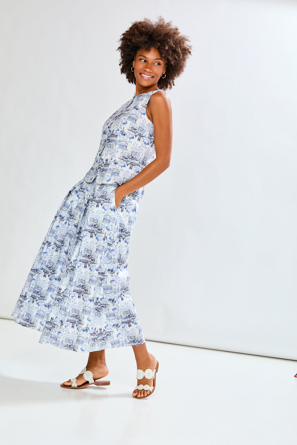 Woman wearing a blue patterned skirt and matching top