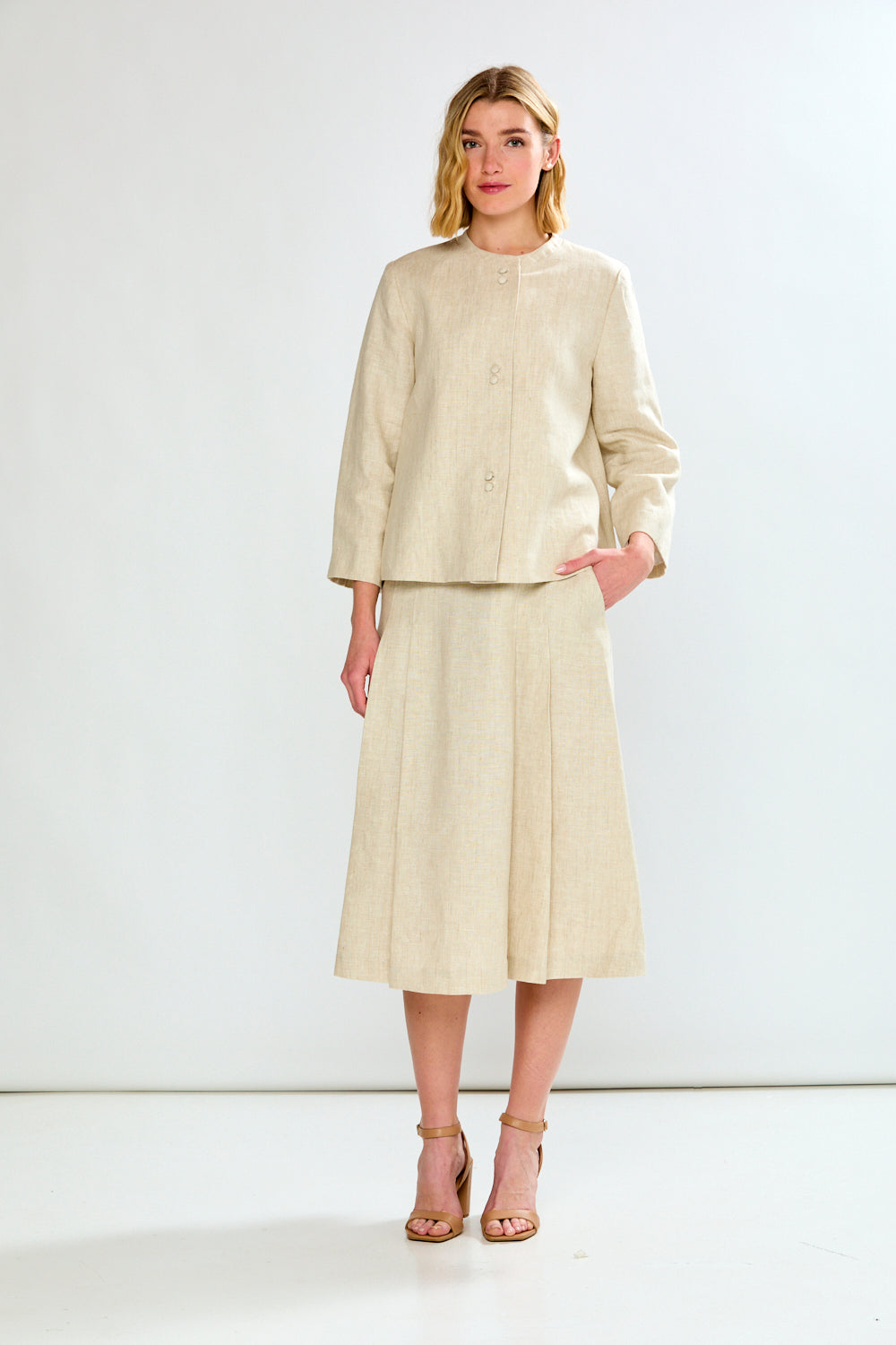 woman in light oatmeal coat