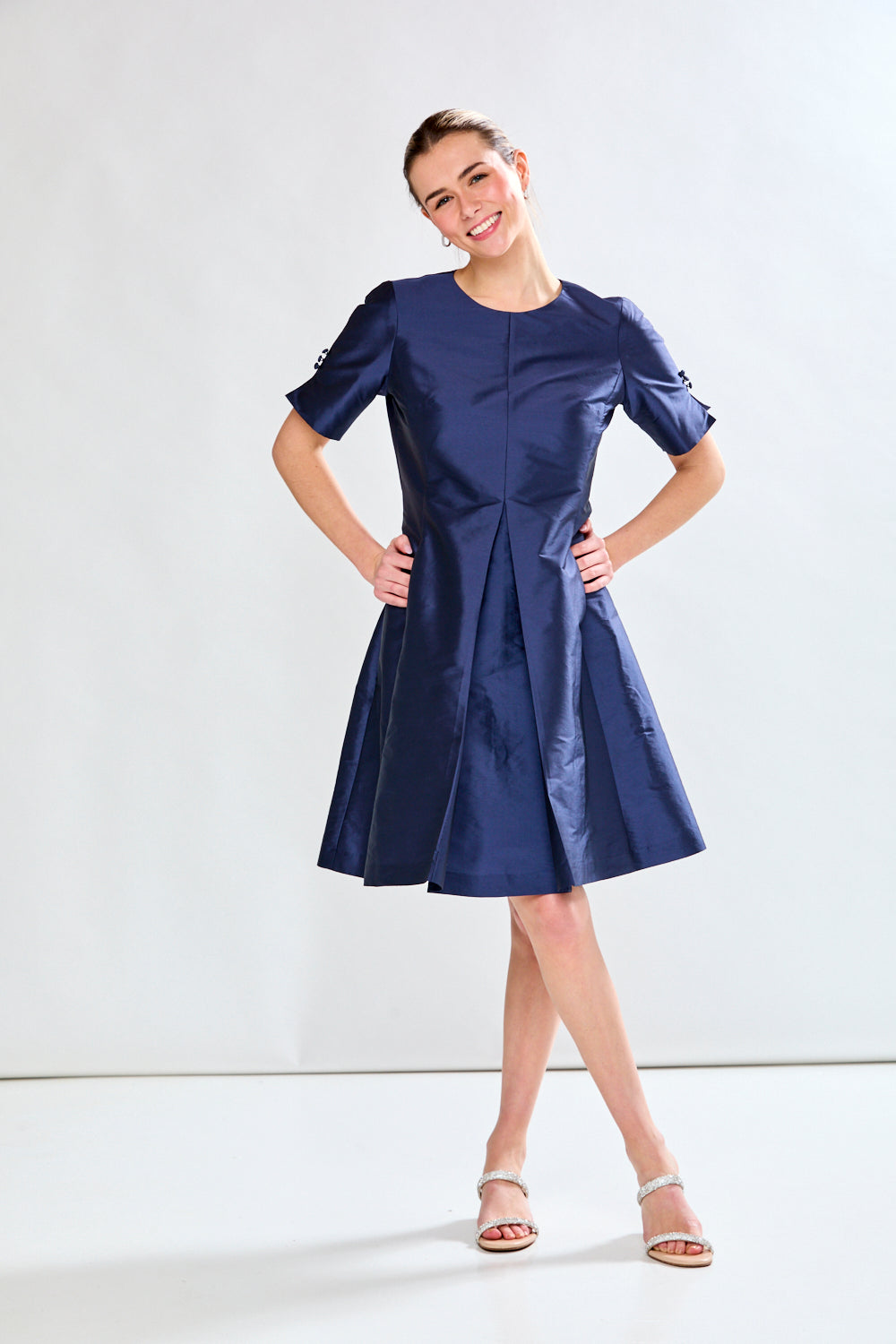 Woman in navy taffeta dress