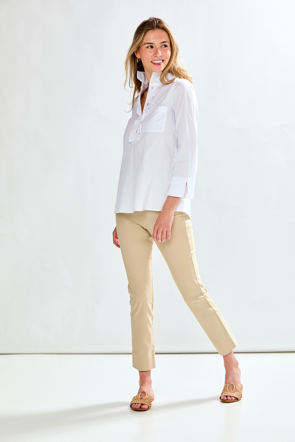 Woman in white blouse with ruffle