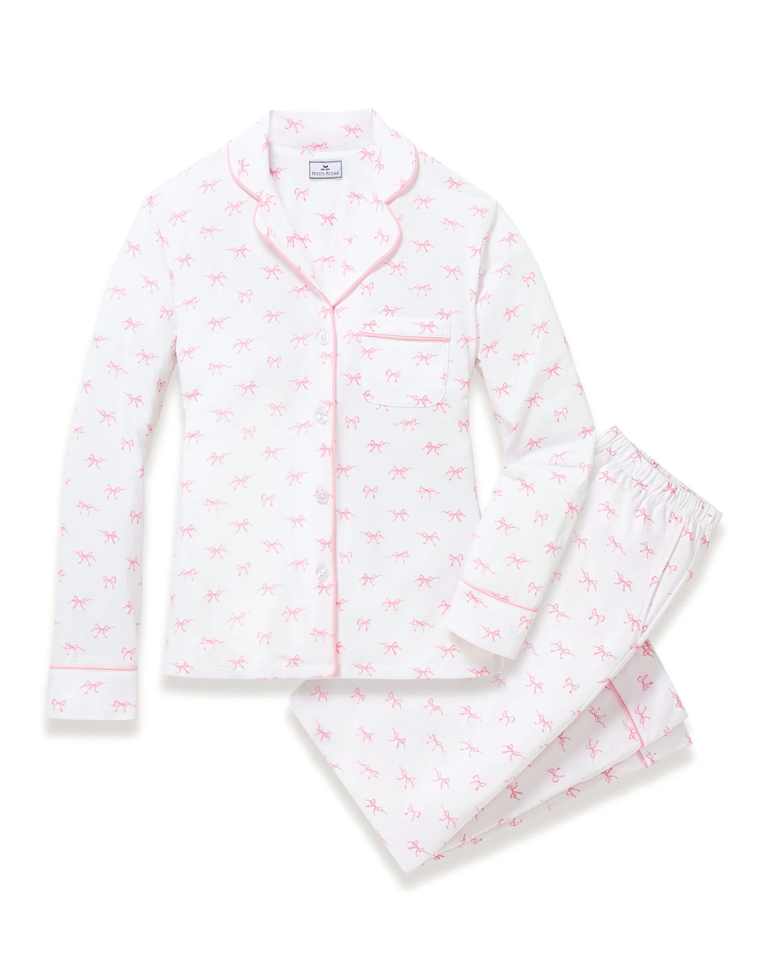 White pajama set with pink flamingo pattern on a white background