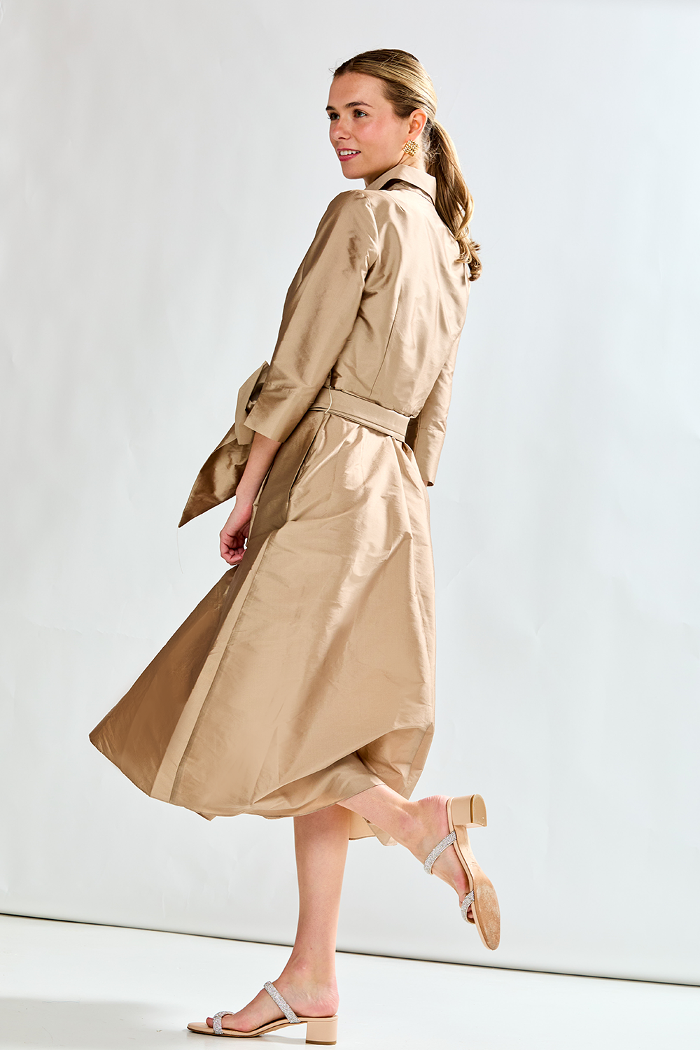Woman in mocha taffeta dress