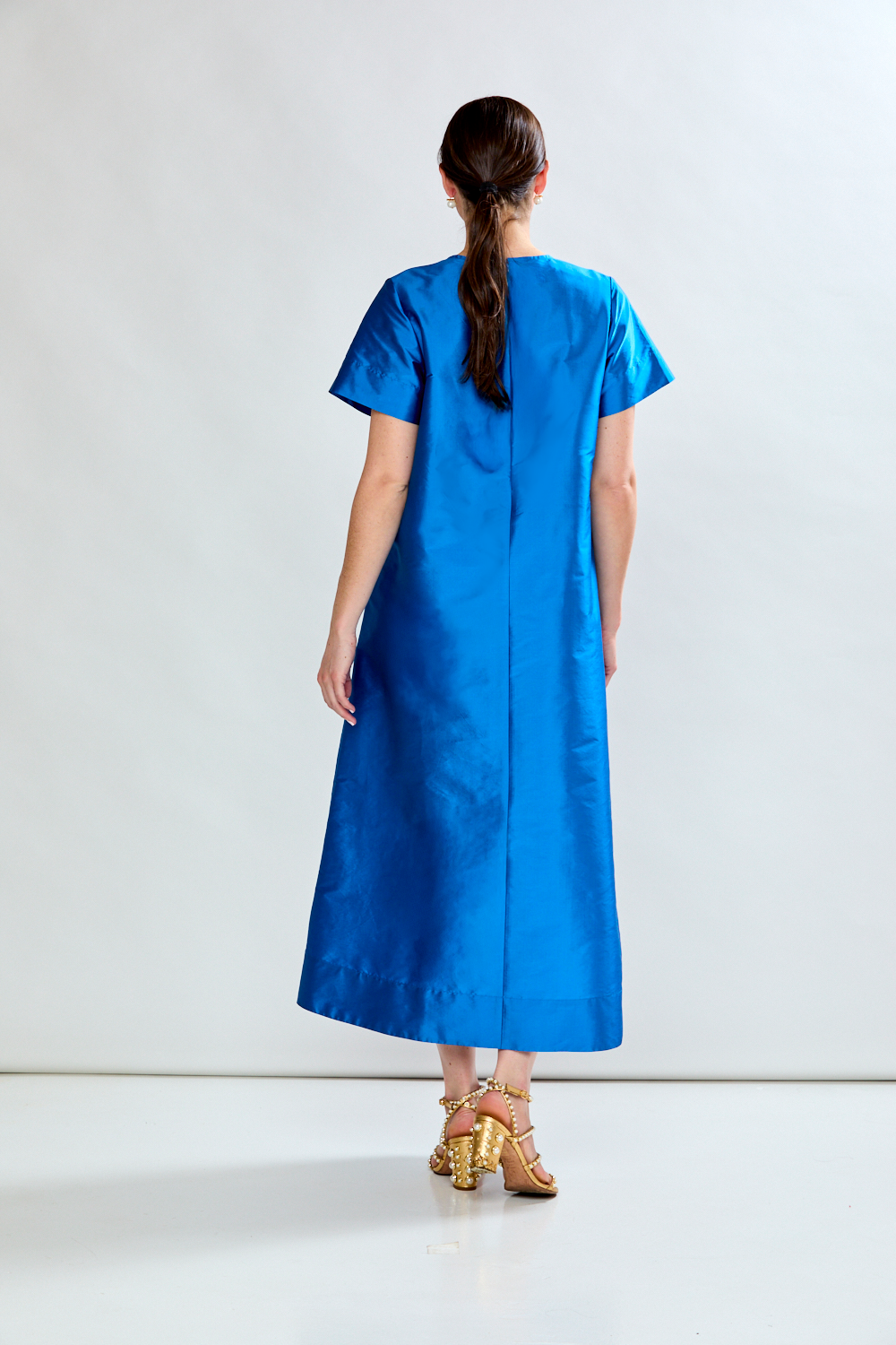Woman in topaz dress 