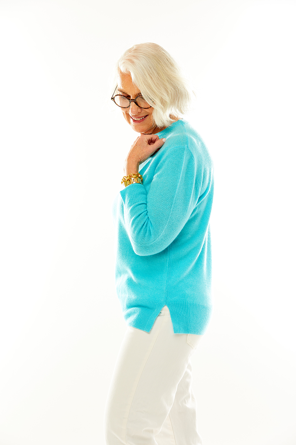 Woman in aqua cashmere pullover