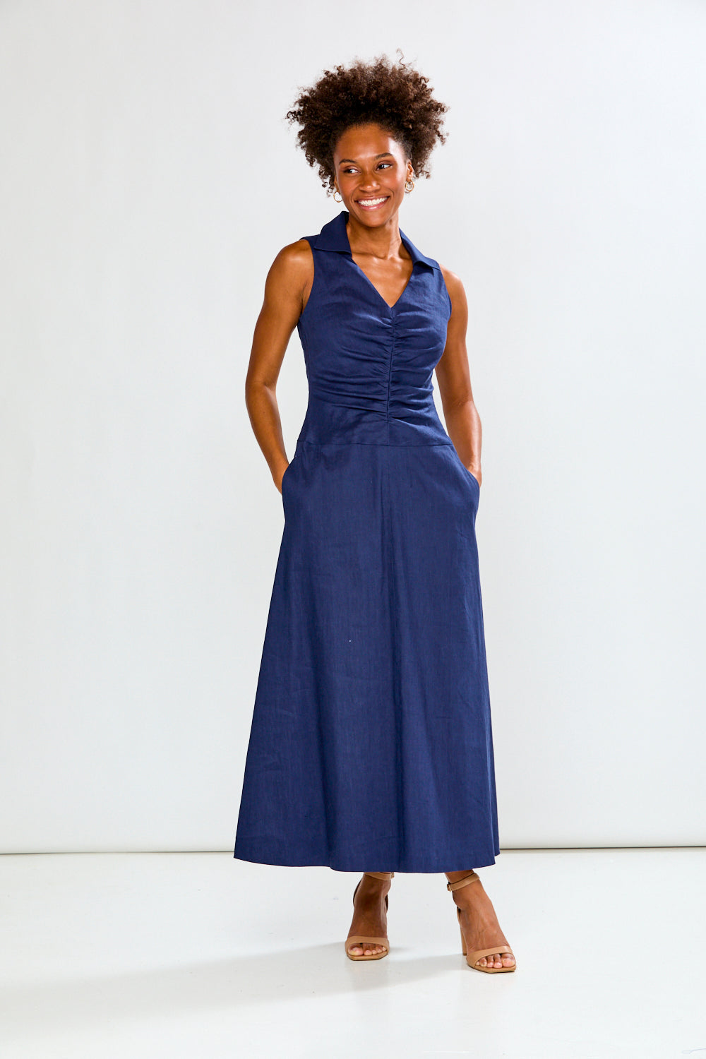 Woman wearing a blue dress on a white background