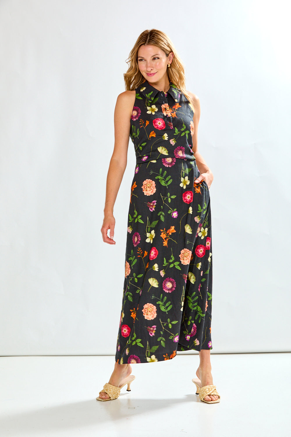 Woman in black linen dress with multi colored flowers