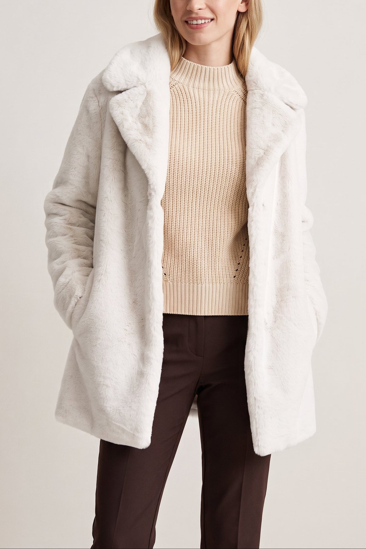 Woman wearing the Kennedy coat in Ivory