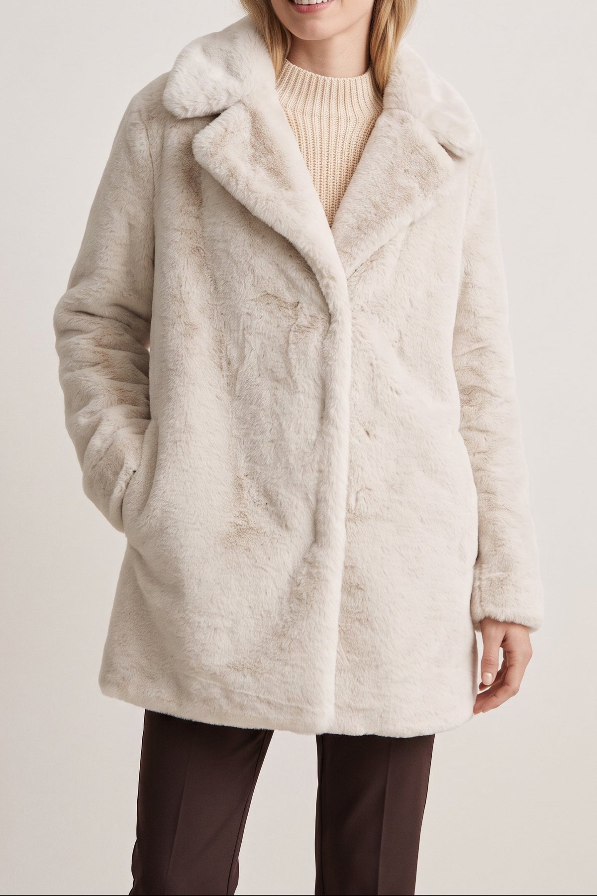 Woman wearing the Kennedy coat in Ivory