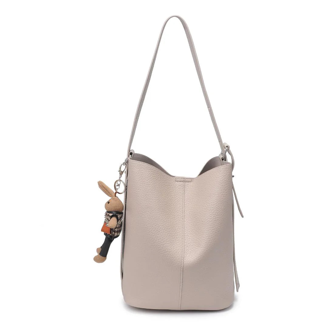 Beige handbag with a bunny charm on a white background