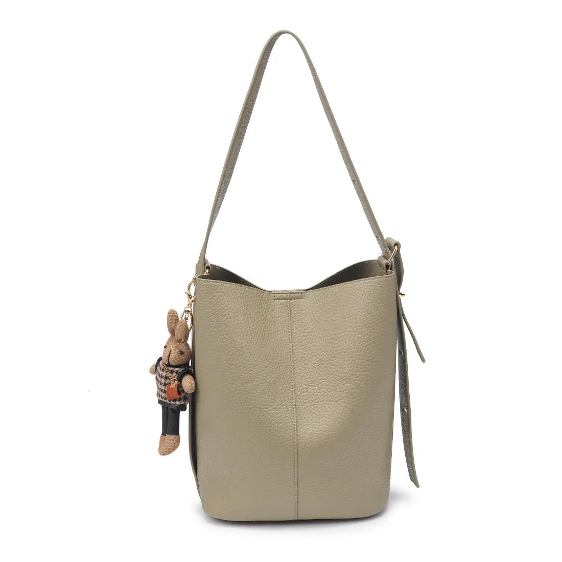 Beige handbag with a small rabbit charm on a white background