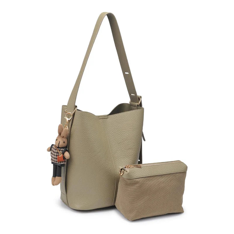 Beige handbag with matching pouch and keychain on a white background