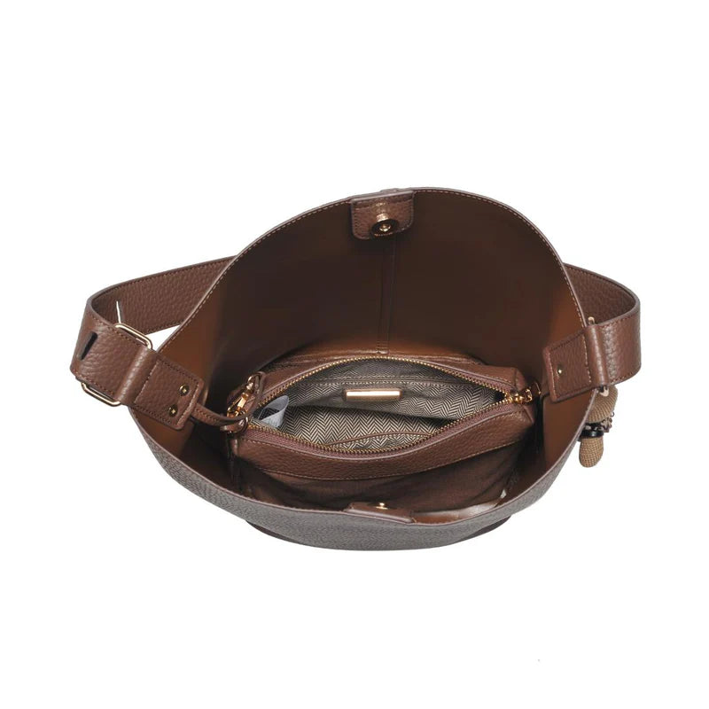 Brown leather bag with a strap on a white background