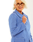 Woman in gingham jacket