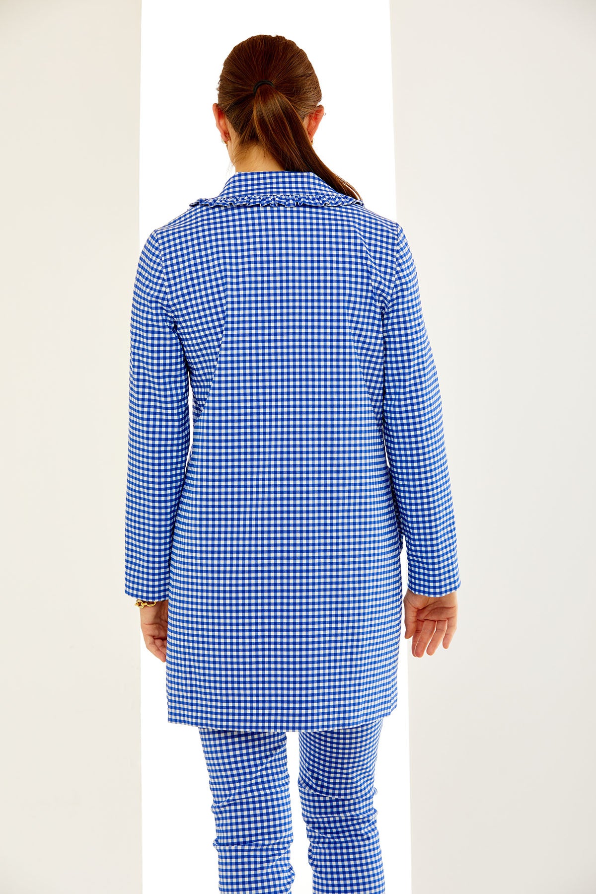 Woman in gingham jacket