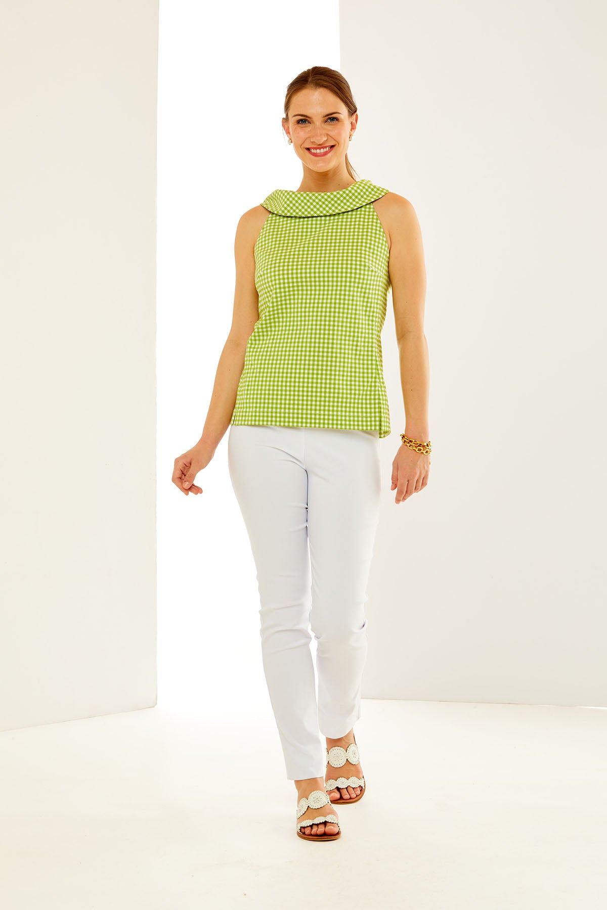 Woman in green and white gingham top