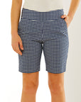 Woman in navy and white gingham short