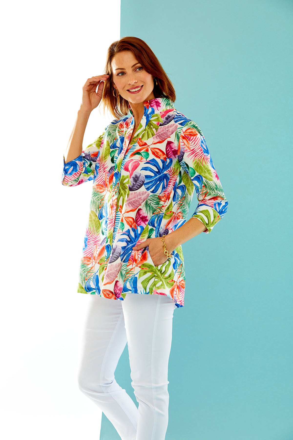woman in multi-color palm print button down tunic