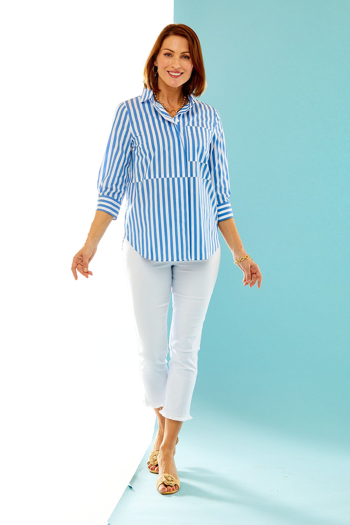 woman wearing ocean blue & white striped button down with front pocket